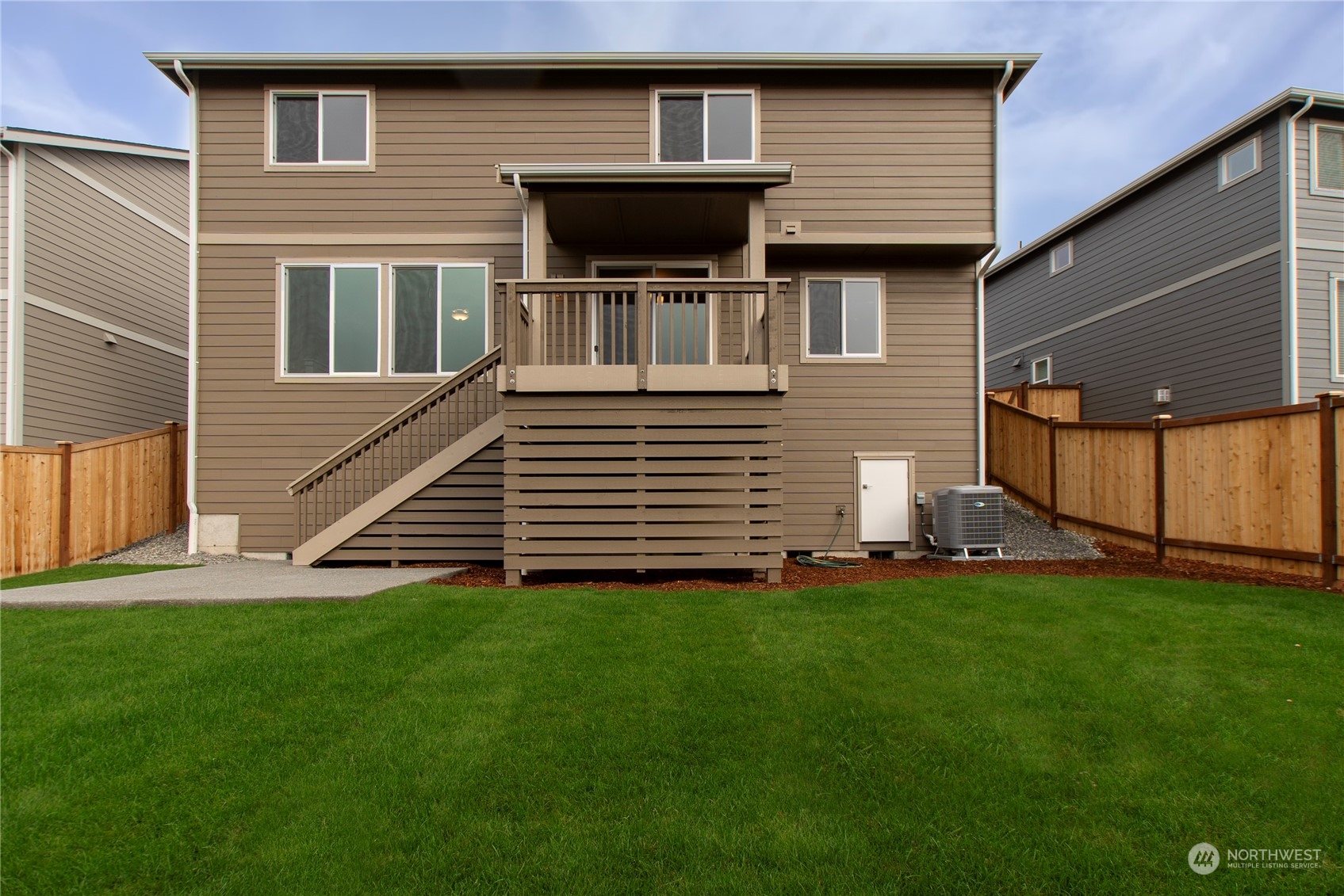 9741 7th Way Southeast Lacey, WA 98513 - Photo 39 of 40 a front view of a house with a yard