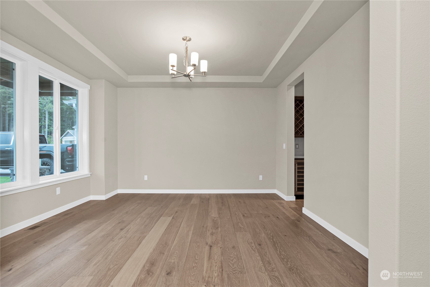9741 7th Way Southeast Lacey, WA 98513 - Photo 6 of 40 wooden floor in an empty room with a window