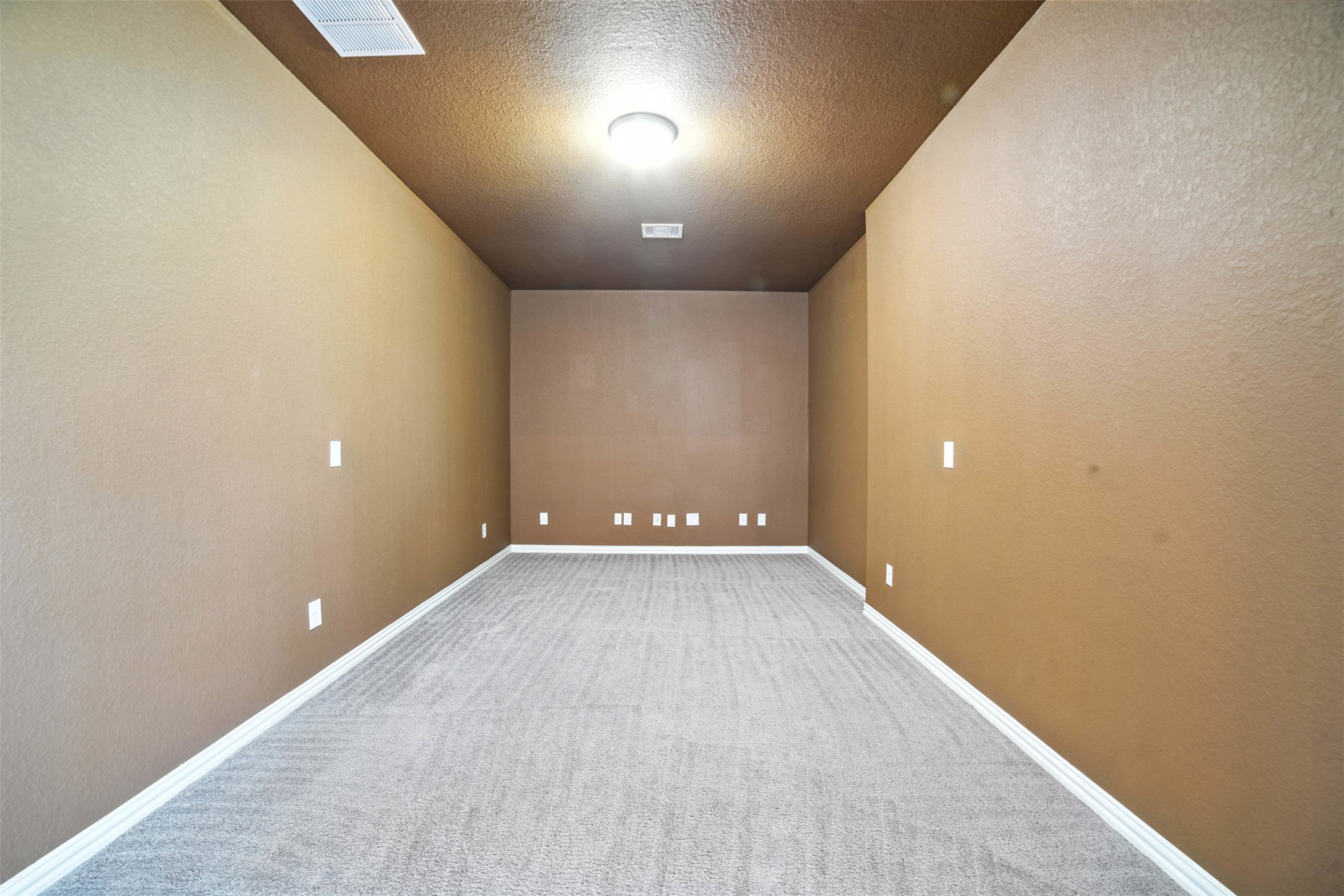 3054 Columbus Loop Round Rock, TX 78665 - Photo 22 of 40 Carpeted empty room featuring a textured wall and a textured ceiling