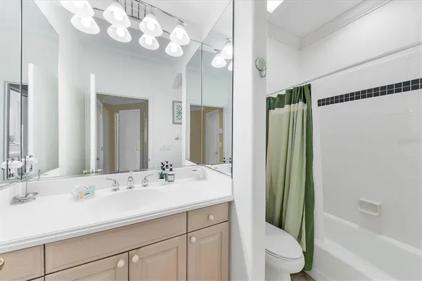a bathroom with a sink double vanity and a mirror