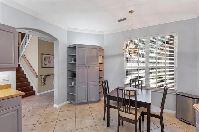 a view of a livingroom with furniture and staircase