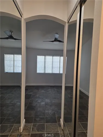 a bathroom with a glass door shower and a sink