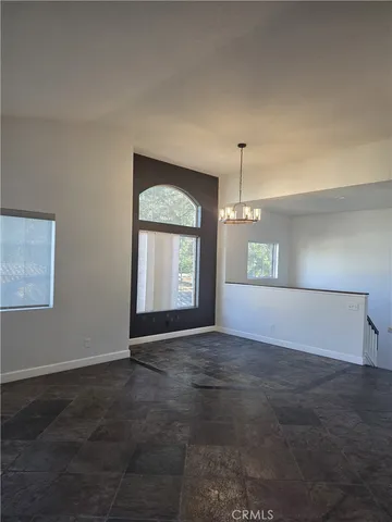 a view of kitchen and hall with wooden floor