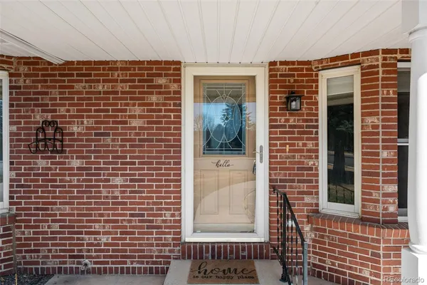 a view of front door of house and building