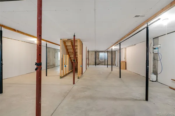 a view of a hallway with staircase