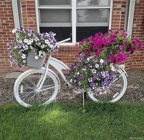 a view of a flower garden with a yard