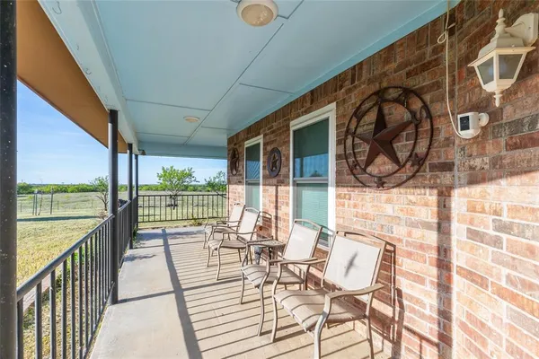 a view of a balcony with chairs
