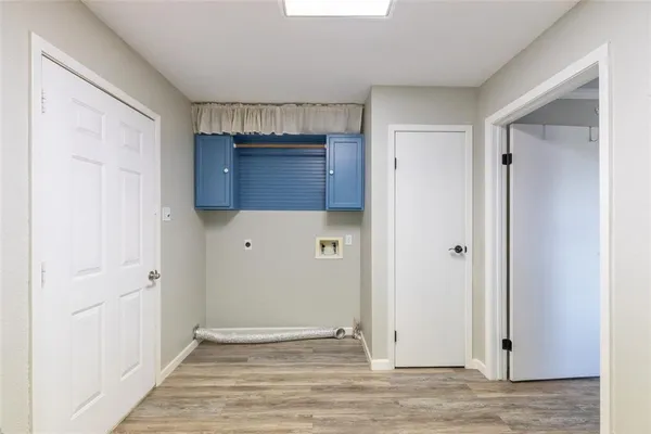 a view of a backyard with large trees