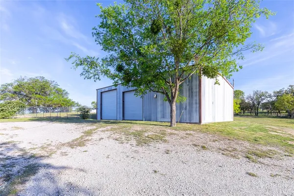 a front view of house with yard and garage