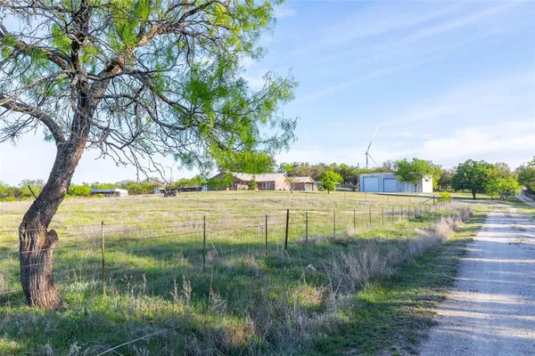 a view of a lake with a big yard
