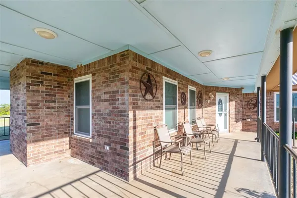 a balcony view with a outdoor seating