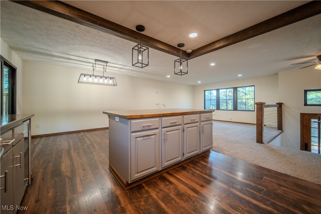 3459 Laubert Road Atwater, OH 44201 - Photo 15 of 39 Kitchen featuring gray cabinets, recessed lighting, dark wood-style flooring, hanging light fixtures, and beam ceiling