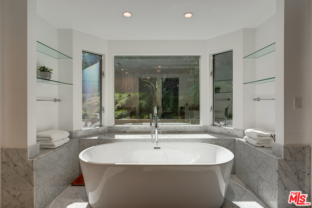 1490 El Mirador Drive Pasadena, CA 91103 - Photo 23 of 52 a white bath tub sitting in a bathroom and sink