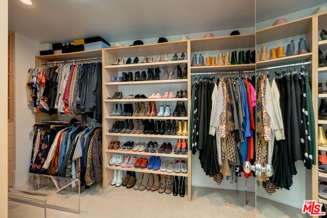 1490 El Mirador Drive Pasadena, CA 91103 - Photo 25 of 52 a view of walk in closet with clothes and shoes