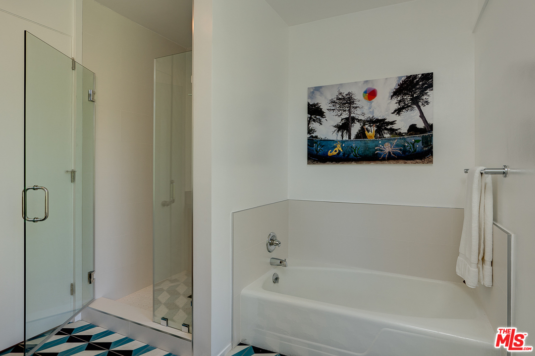 1490 El Mirador Drive Pasadena, CA 91103 - Photo 29 of 52 a bathroom with a tub and shower