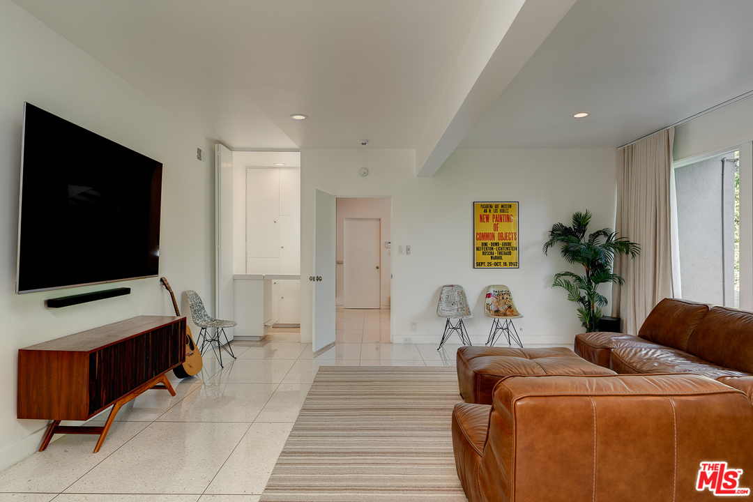 1490 El Mirador Drive Pasadena, CA 91103 - Photo 31 of 52 a living room with furniture and a flat screen tv