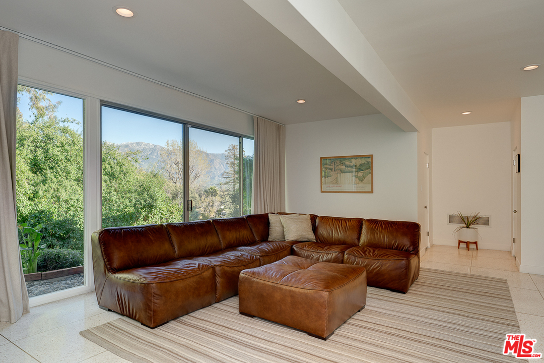 1490 El Mirador Drive Pasadena, CA 91103 - Photo 32 of 52 a living room with furniture and a large window