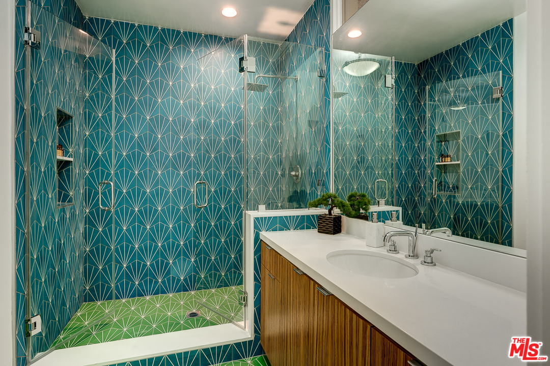 1490 El Mirador Drive Pasadena, CA 91103 - Photo 33 of 52 a bathroom with a sink and a mirror