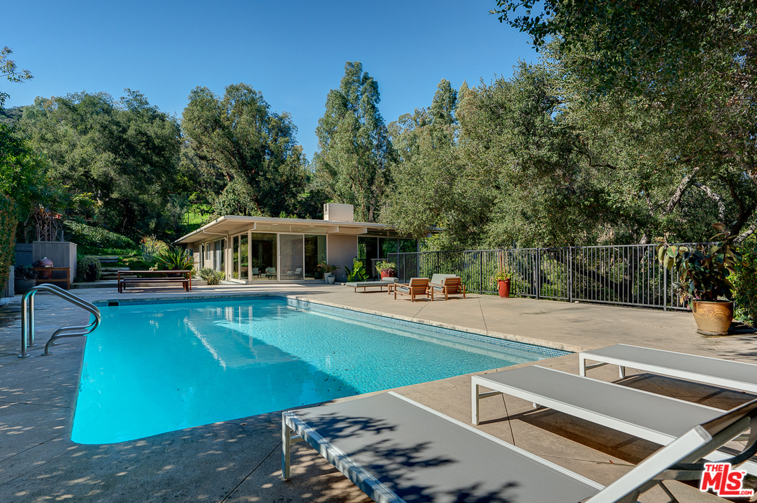 1490 El Mirador Drive Pasadena, CA 91103 - Photo 37 of 52 a view of a swimming pool with chairs