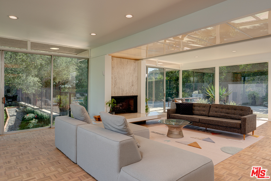 1490 El Mirador Drive Pasadena, CA 91103 - Photo 6 of 52 a living room with furniture and a fireplace