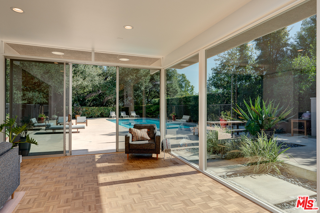 1490 El Mirador Drive Pasadena, CA 91103 - Photo 7 of 52 a building outdoor space with patio furniture and potted plants