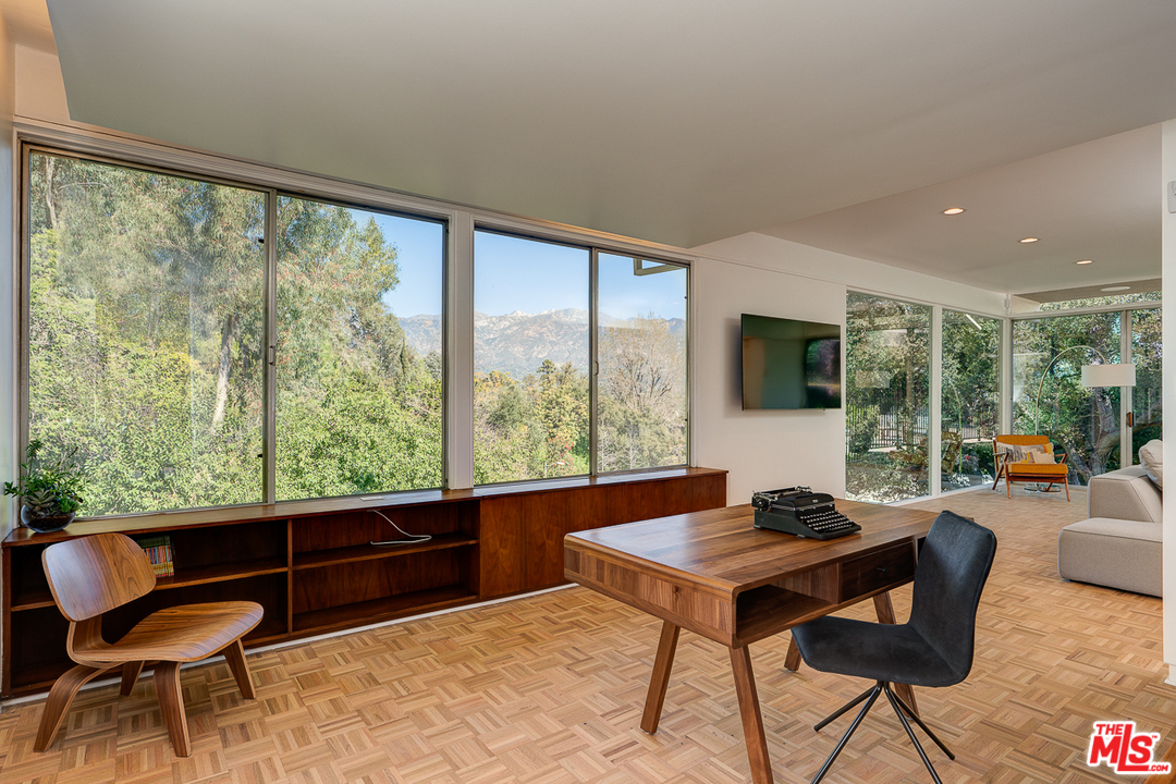 1490 El Mirador Drive Pasadena, CA 91103 - Photo 9 of 52 a living room with furniture and a large window