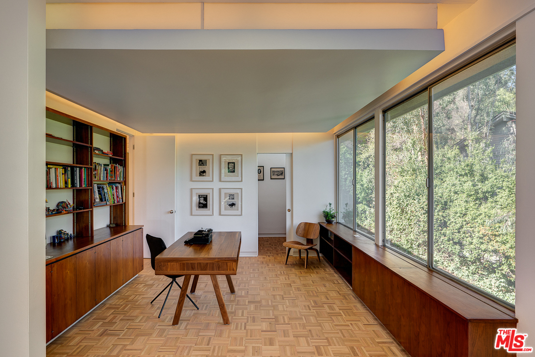 1490 El Mirador Drive Pasadena, CA 91103 - Photo 10 of 52 a bedroom with furniture and a large window