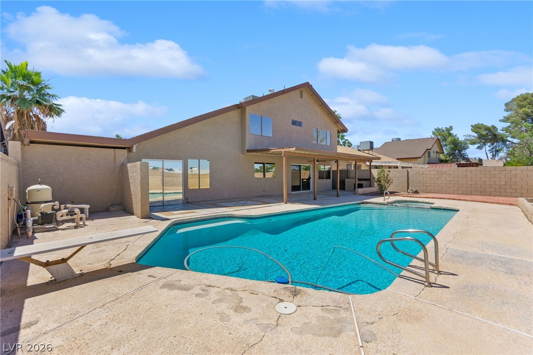 4430 Cranbrook Way Las Vegas, NV 89103 - Photo 24 of 50 A private backyard oasis features an inviting in-ground pool, perfect for leisure.