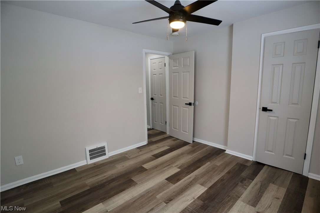 4824 Anderson Road Cleveland, OH 44124 - Photo 14 of 15 Spare room with dark hardwood / wood-style floors and ceiling fan