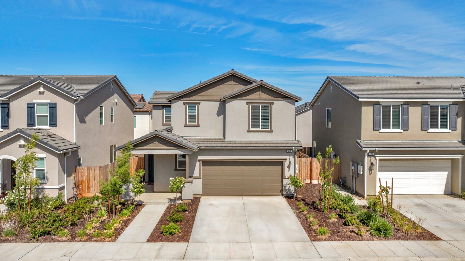 317 Talus Way South Madera, CA 93636 - Photo 1 of 61 a front view of a house with a yard