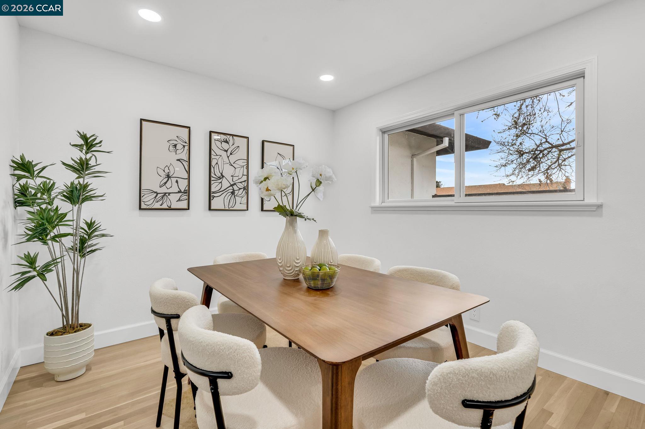 1548 Dianda Drive Concord, CA 94521 - Photo 17 of 59 a dining room with furniture and wooden floor