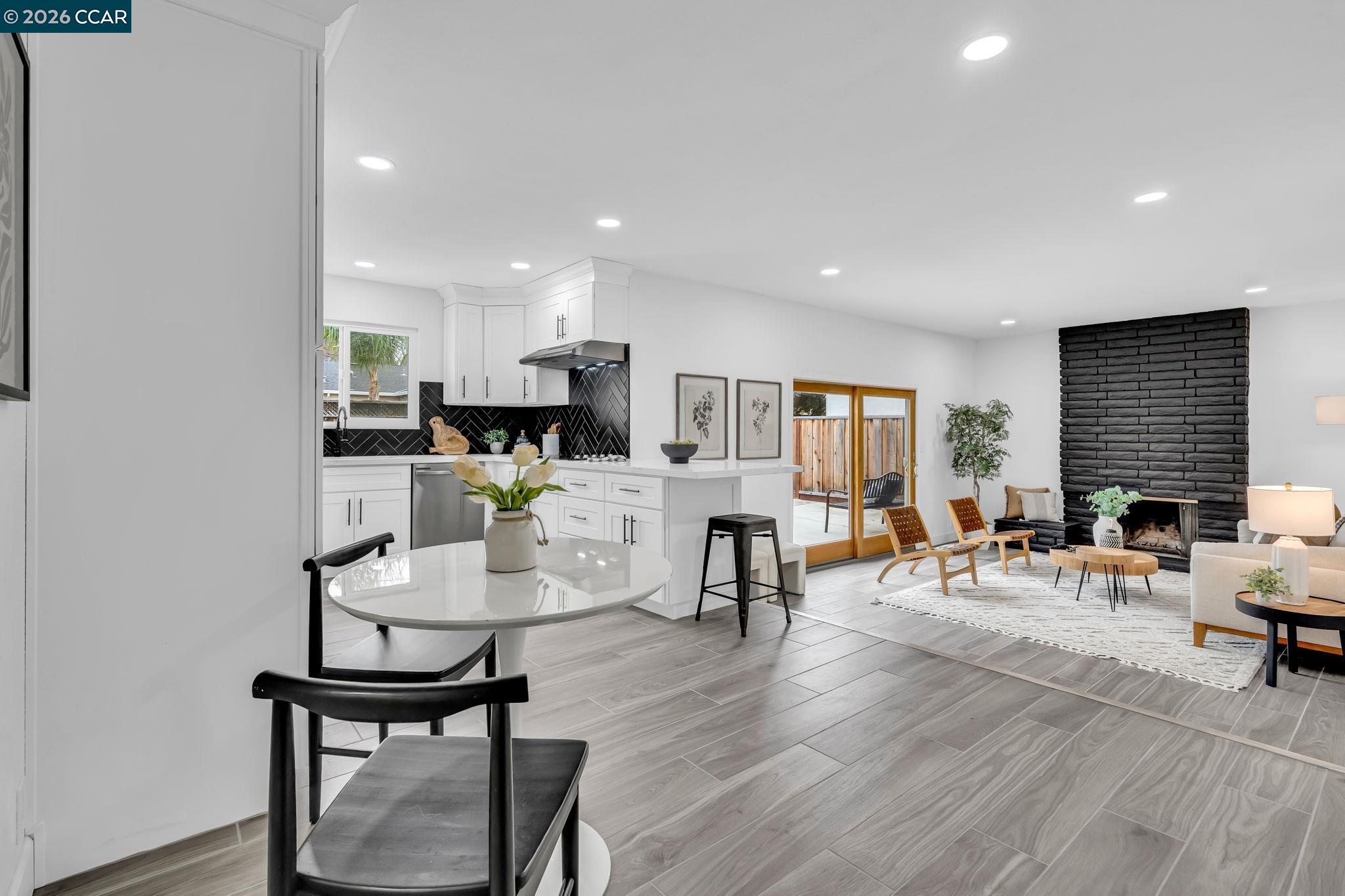 1548 Dianda Drive Concord, CA 94521 - Photo 18 of 59 a living room with lots of furniture and kitchen view