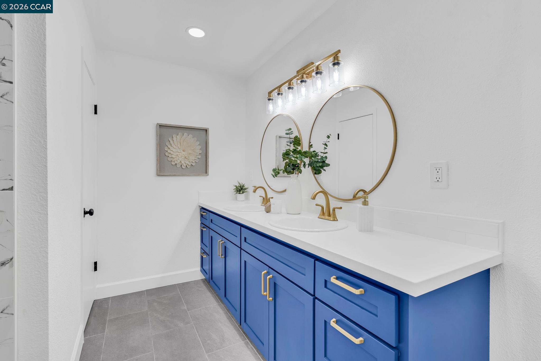 1548 Dianda Drive Concord, CA 94521 - Photo 30 of 59 a bathroom with a sink and a mirror