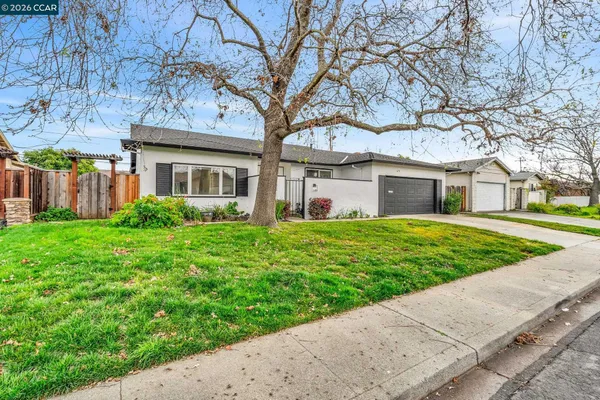 a view of a hallway with paintings on the wall