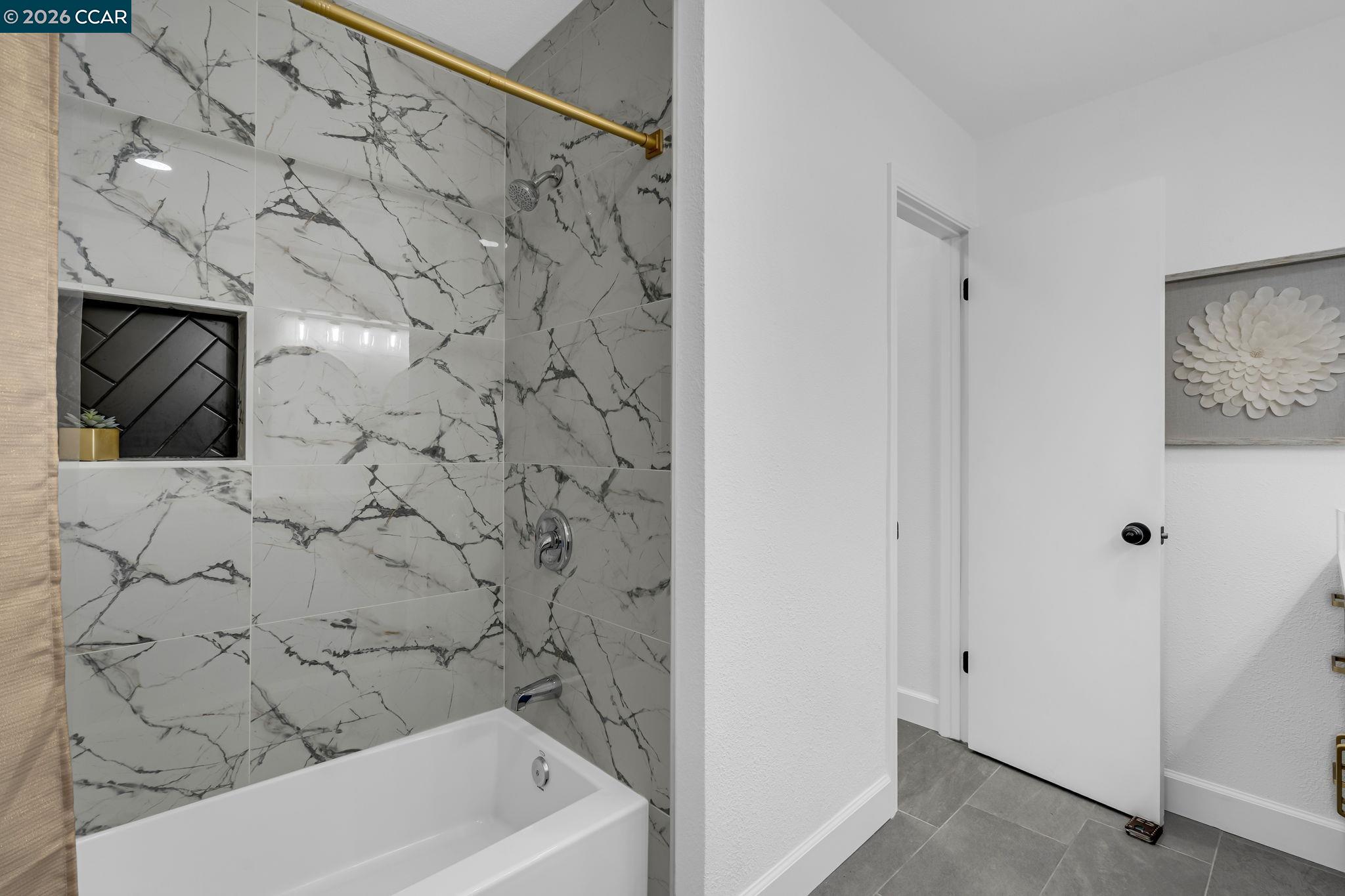 1548 Dianda Drive Concord, CA 94521 - Photo 31 of 59 a bathroom with a bathtub and a shower