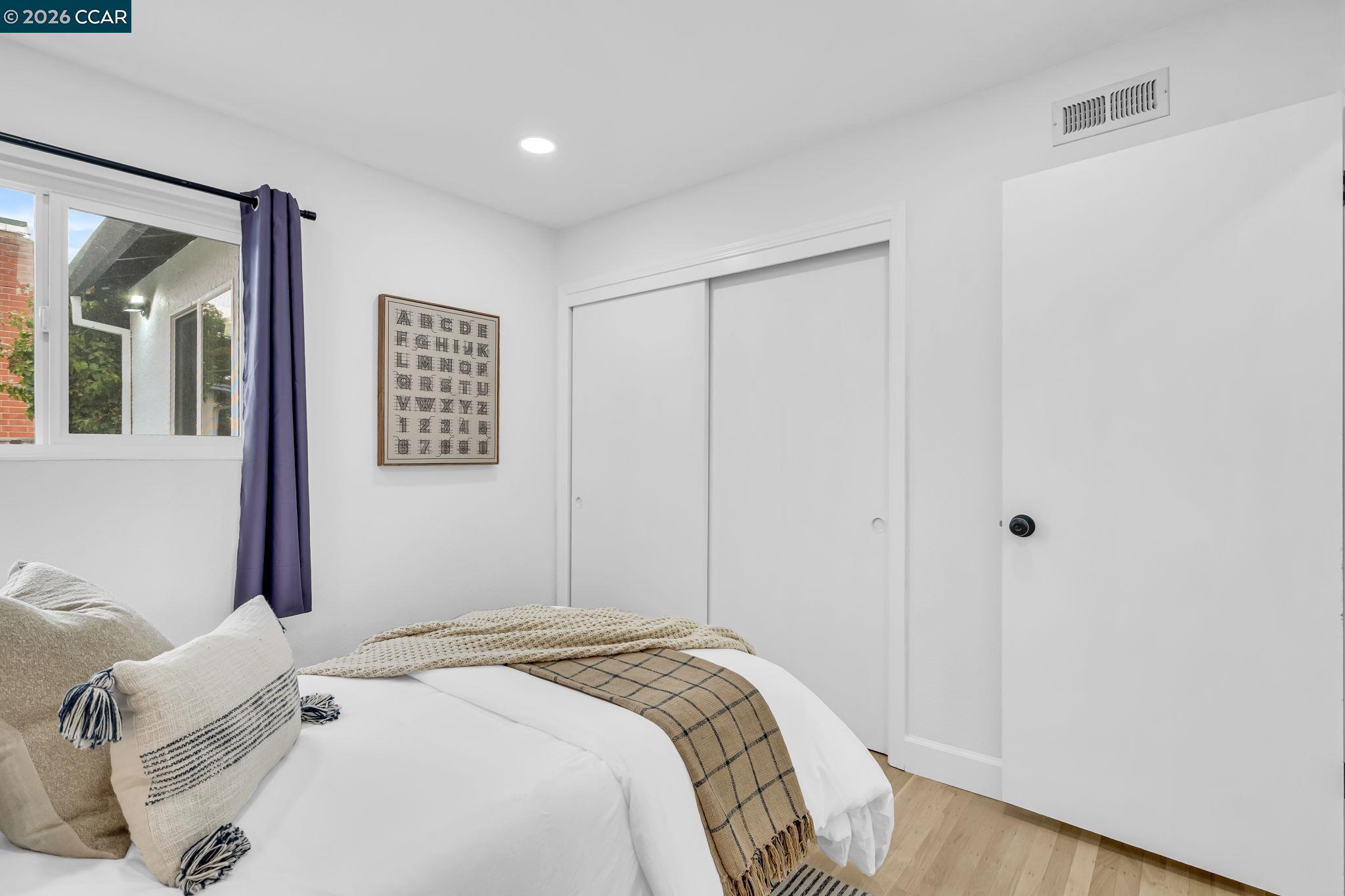 1548 Dianda Drive Concord, CA 94521 - Photo 42 of 59 a bedroom with a bed and a mirror