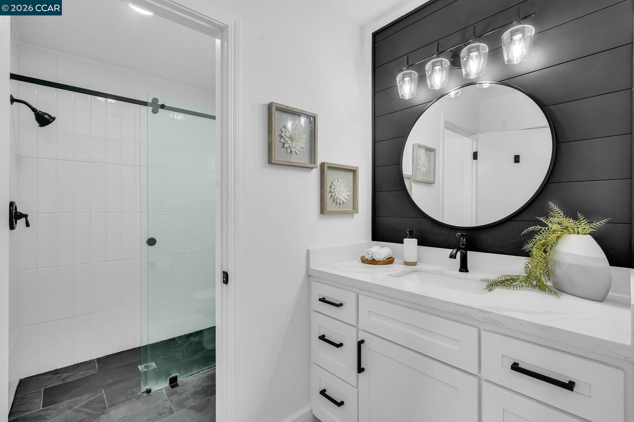 1548 Dianda Drive Concord, CA 94521 - Photo 51 of 59 a bathroom with a sink mirror and vanity