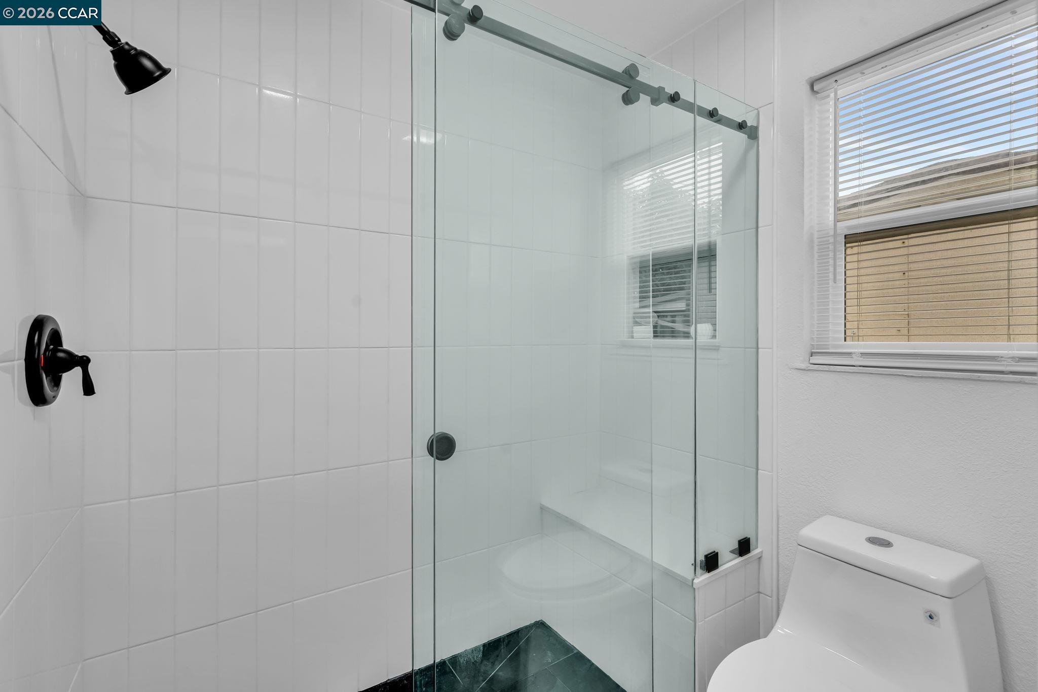 1548 Dianda Drive Concord, CA 94521 - Photo 52 of 59 a bathroom with a toilet and a shower