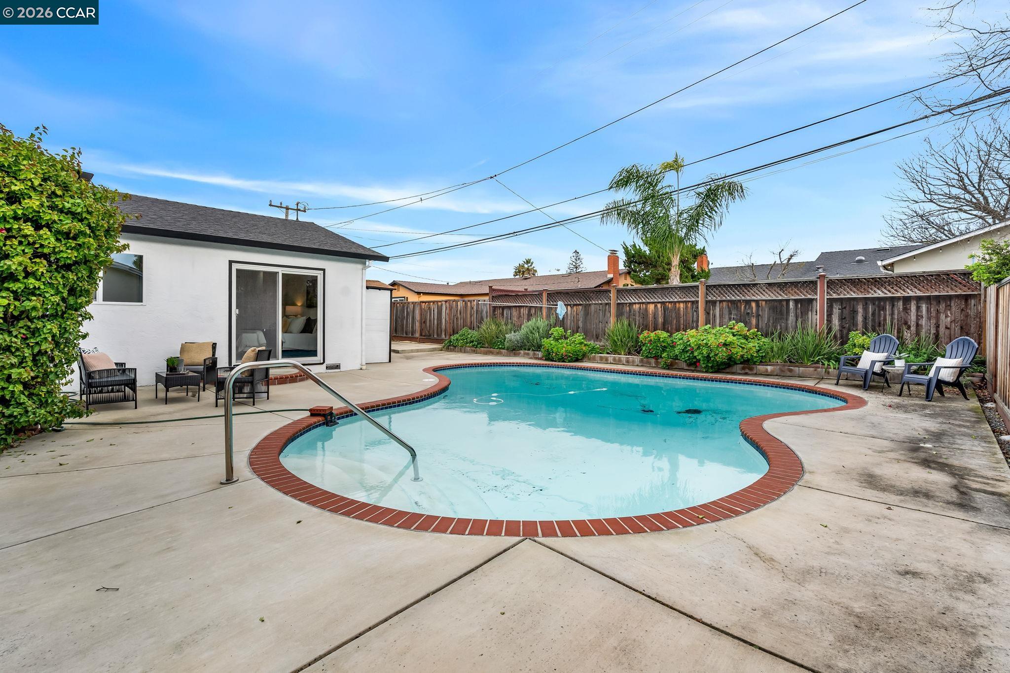1548 Dianda Drive Concord, CA 94521 - Photo 58 of 59 a view of a swimming pool with a patio