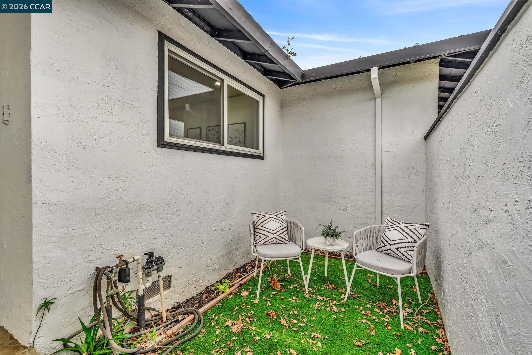 1548 Dianda Drive Concord, CA 94521 - Photo 6 of 59 a chair and a table in a patio