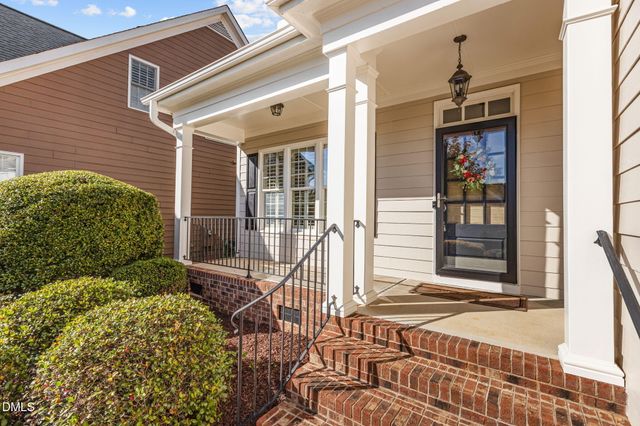 a front view of a house with a glass windows