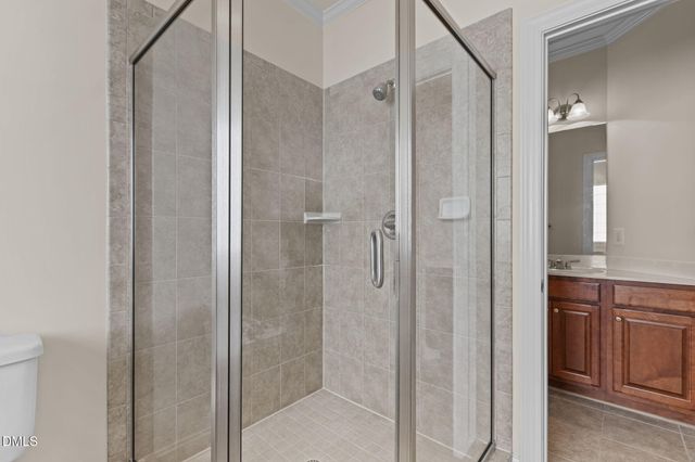 a bathroom with a shower and a sink