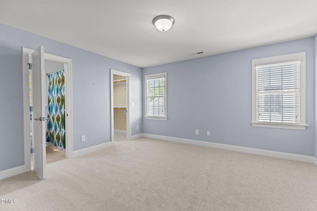an empty room with closet area