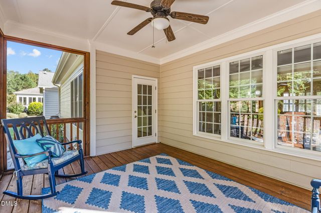 a view of backyard with deck and garden
