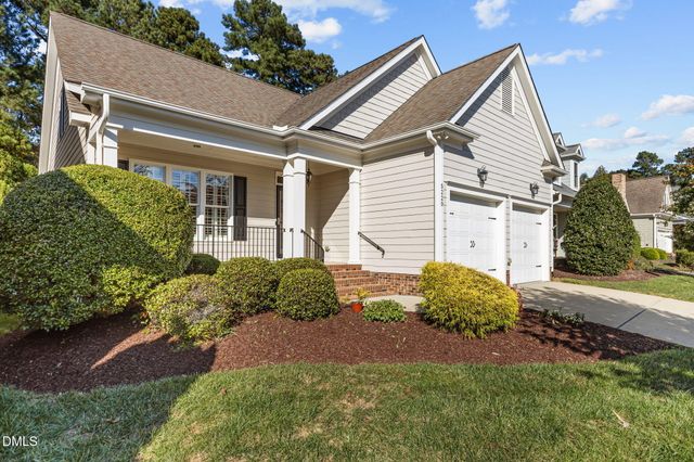 a view of a backyard with sitting area