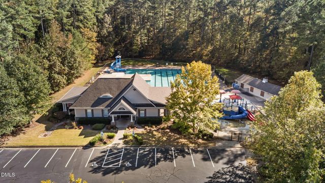 a view of a yard with chairs