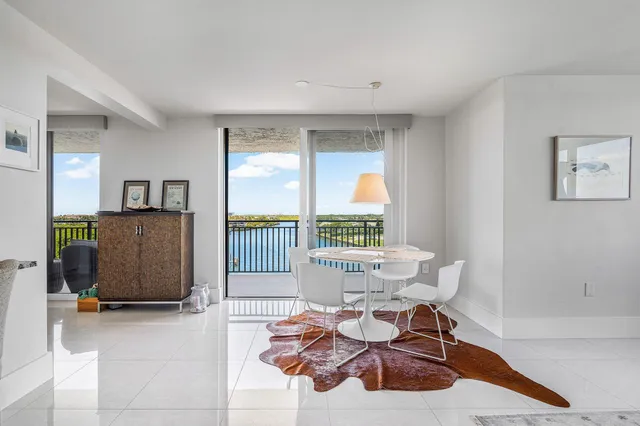 a living room with furniture and large window