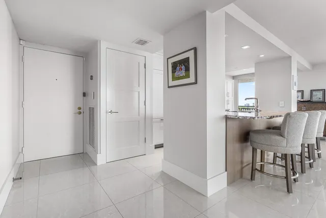 a view of a livingroom with furniture and a window