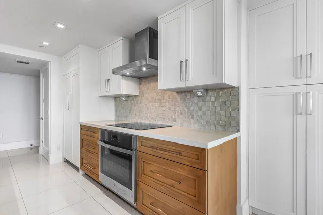 a kitchen with stainless steel appliances granite countertop a stove and a sink