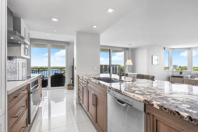 a large kitchen with granite countertop a lot of counter space
